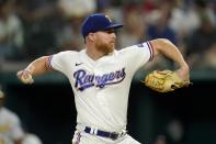 Texas Rangers starting pitcher Jon Gray throws to the Oakland Athletics in the fourth inning of a baseball game, Wednesday, July 13, 2022, in Arlington, Texas. (AP Photo/Tony Gutierrez)