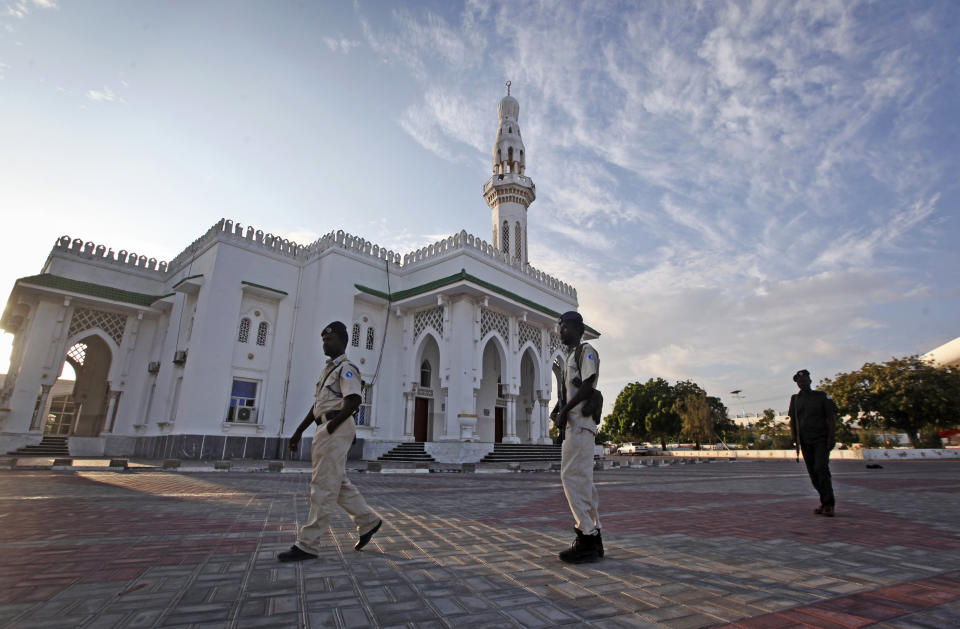 In this Tuesday, Oct. 30, 2018, photo Somali security forces patrol in front of the Isbaheysiga mosque, or Mosque of Islamic Solidarity, the largest in the capital Mogadishu, in Somalia. Synagogues, mosques, churches and other houses of worship are routinely at risk of attack in many parts of the world. And so worshippers themselves often feel the need for visible, tangible protection even as they seek the divine. (AP Photo/Farah Abdi Warsameh)