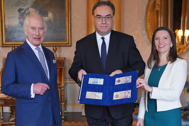 <p>YUI MOK/POOL/AFP via Getty</p> King Charles, Bank of England Governor Andrew Bailey and Bank of England's Chief Cashier Sarah John at Buckingham Palace in London on April 9, 2024