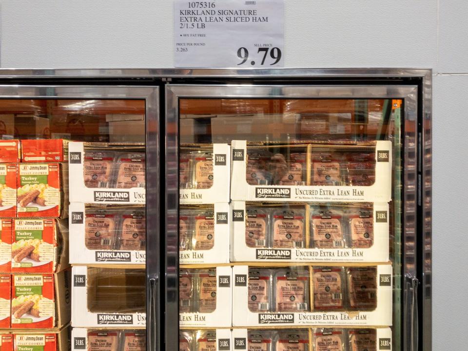 packets of sliced ham in freezer in costco with price tag above it