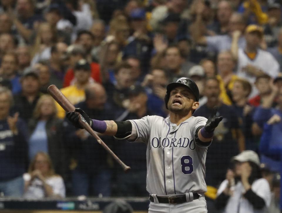 Colorado Rockies' Gerardo Parra reacts after striking out during the sixth inning of Game 2 of the National League Divisional Series baseball game against the Milwaukee Brewers Friday, Oct. 5, 2018, in Milwaukee. (AP Photo/Jeff Roberson)