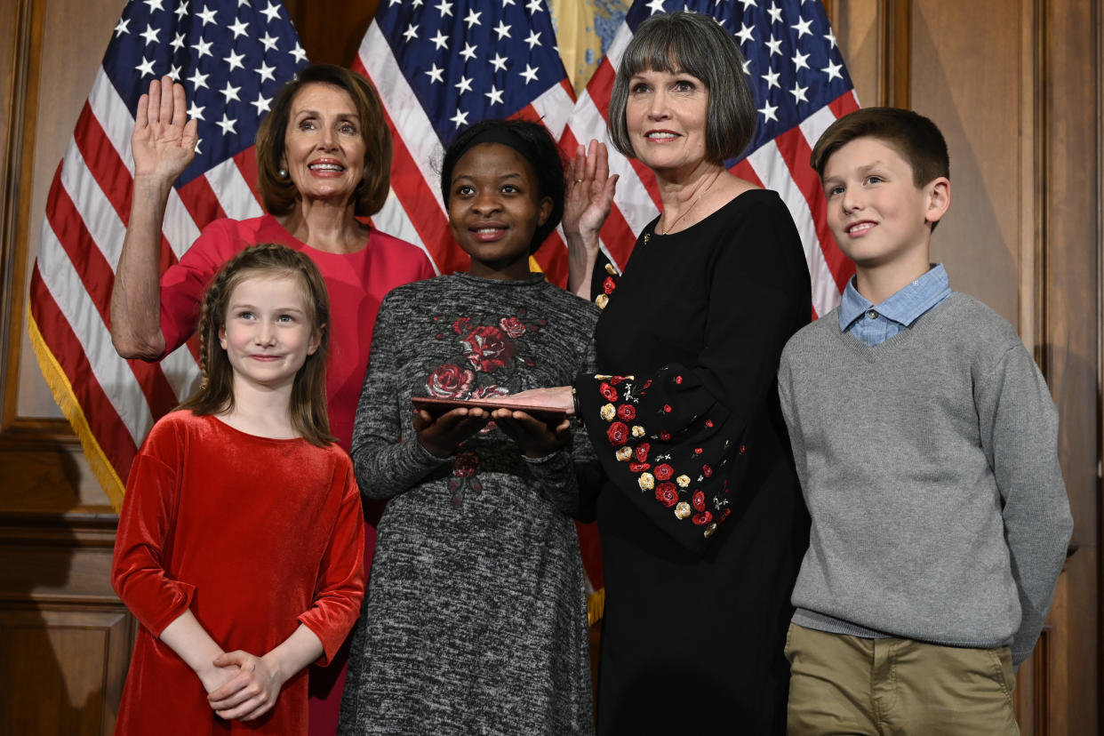 House Speaker Nancy Pelosi of Calif., left, poses during a ceremonial swearing-in with Rep. Betty McCollum, D-Minn., second from right, on Capitol Hill in Washington, Thursday, Jan. 3, 2019, during the opening session of the 116th Congress. (AP Photo/Susan Walsh)