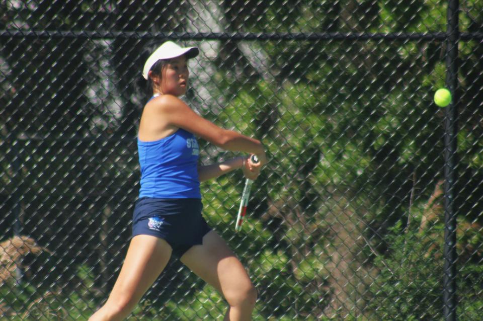 Stanton's Katie Wong prepares a return against Fletcher's Kaylee Munson in the Gateway Conference high school girls tennis championships on April 4, 2024. [Clayton Freeman/Florida Times-Union]