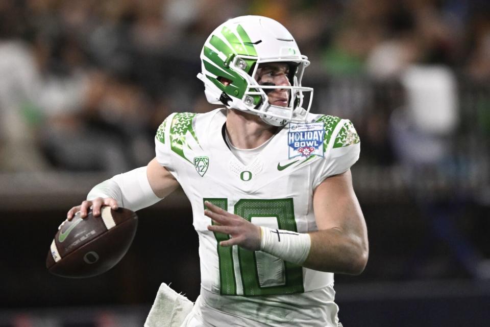 Oregon quarterback Bo Nix looks to pass against North Carolina in the Holiday Bowl on Dec. 28.