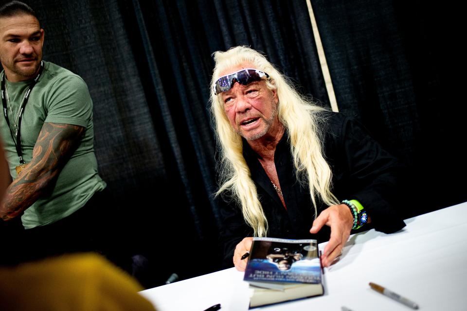 Duane Lee “Dog” Chapman signs an autograph for a fan at Bubba Fest at the Knoxville Convention Center in Knoxville, Tennessee, on Saturday, August 24, 2019.