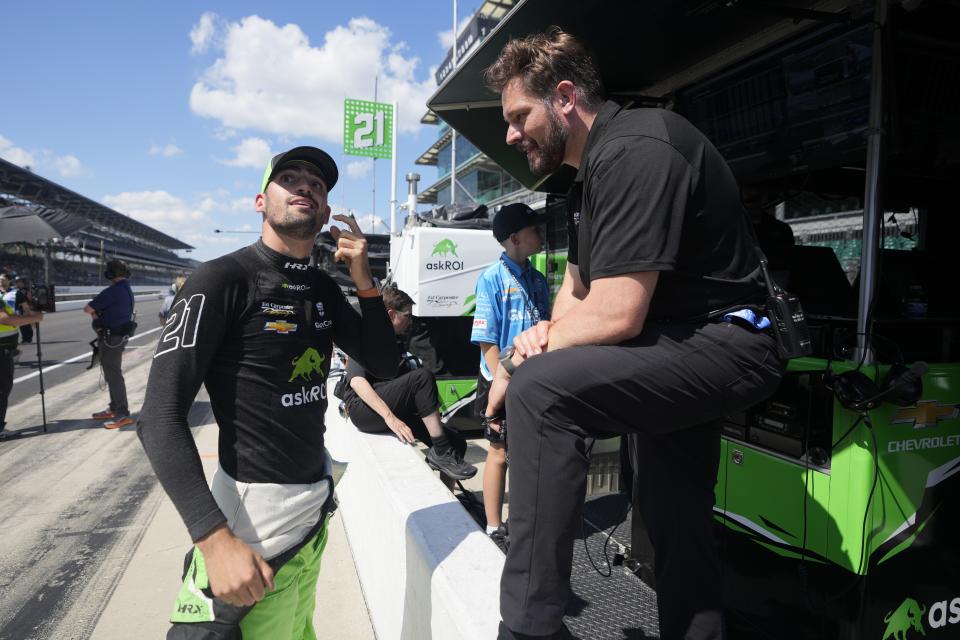 Rinus VeeKay, of The Netherlands, talks with a crew member during qualifications for the Indianapolis 500 auto race at Indianapolis Motor Speedway, Saturday, May 18, 2024, in Indianapolis. (AP Photo/Darron Cummings)