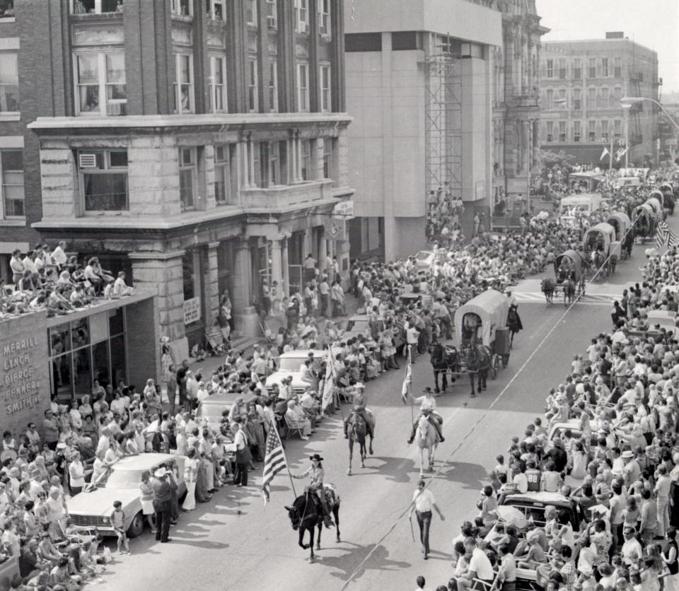 This photo shows part of an extensive parade that took place in downtown Zanesville during the Zane Trace Commemoration in years past. Thousands of people would line the streets for the parade and take part in the many events and contests such as kissing and beard contests, and the anything that floats but a boat contest on the river.