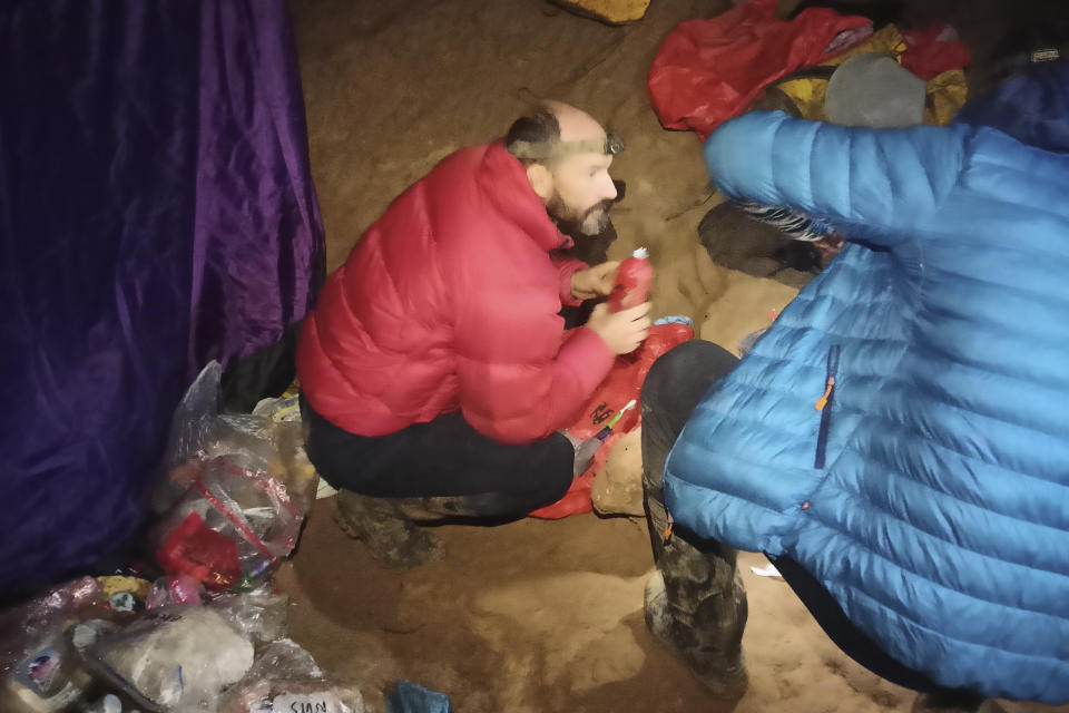 American caver Mark Dickey, left, 40, talks to a colleague inside the Morca cave near Anamur, southern Turkey, Thursday, Sept. 7, 2023. Turkish and international cave rescue experts are working to save an American speleologist trapped at a depth of more than 1,000 meters (3,280 feet) in a cave in southern Turkey after he became ill. (Turkish Government Directorate of Communications via AP)