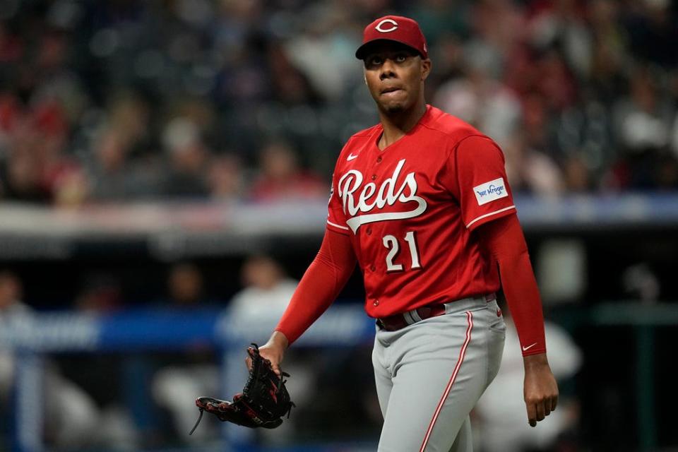 Cincinnati Reds starting pitcher Hunter Greene walks off the field after being taken removed during the fourth inning of the team's baseball game against the Cleveland Guardians, Tuesday, Sept. 26, 2023, in Cleveland. (AP Photo/Sue Ogrocki)