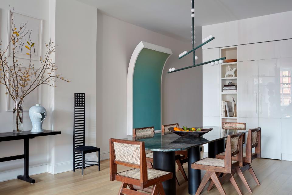 “My only real stipulation to buying art, and that extends to my furnishings, is that I have to love it,” says Rubio. Anchored by an imposing custom steel and marble table surrounded by vintage, earthy Pierre Jeanneret dining chairs, Rubio’s dining room also features an adjacent Peter Gronquist piece, and a Lindsey Adelman Drop System chandelier in a verdigris finish hangs above.
