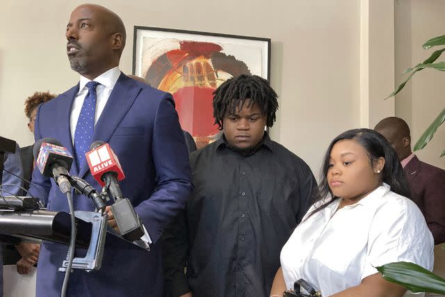 <p>Sudhin Thanawala/AP Photo</p> Attorney Cory Lynch, left, joined by Treveon Isaiah Taylor, Sr. and Jessica Ross