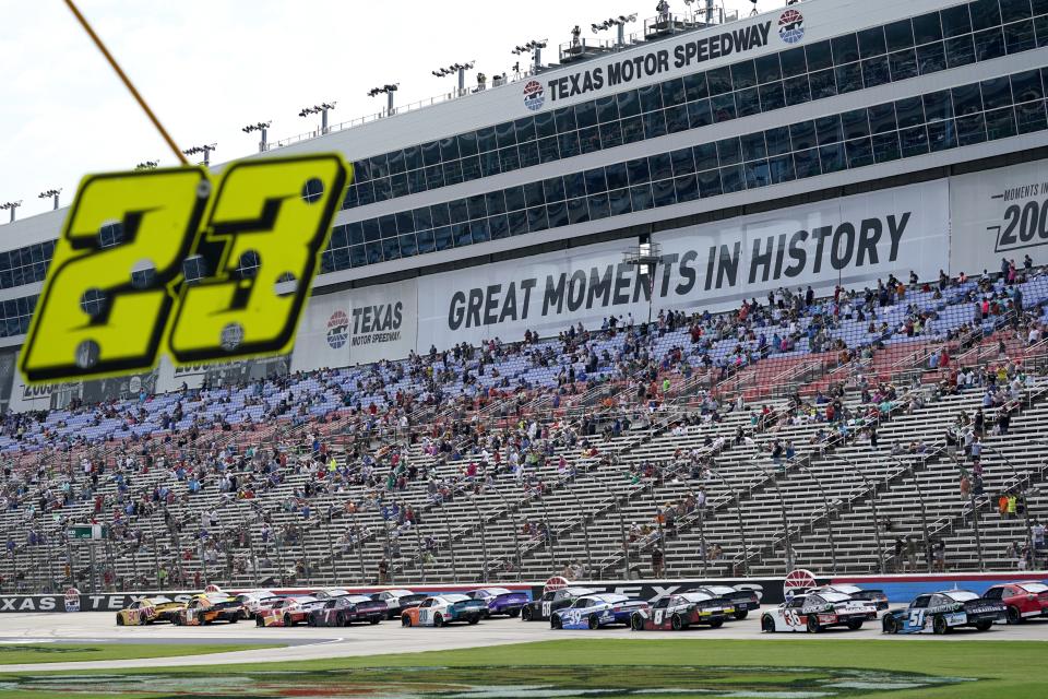 Drivers head down the front stretch during a NASCAR Xfinity Series auto race at Texas Motor Speedway in Fort Worth, Texas, Saturday, June 12, 2021. (AP Photo/Tony Gutierrez)