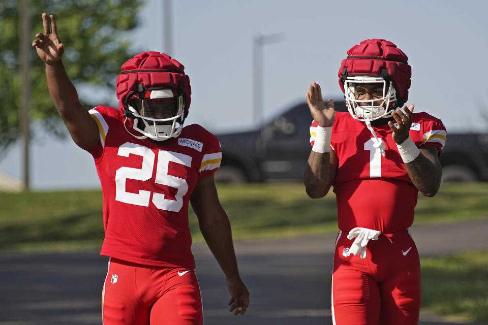 Kansas City Chiefs running backs Jerick McKinnon (1) and Clyde Edwards-Helaire (25) arrive at NFL football training camp Friday, July 28, 2023, in St. Joseph, Mo. (AP Photo/Charlie Riedel)