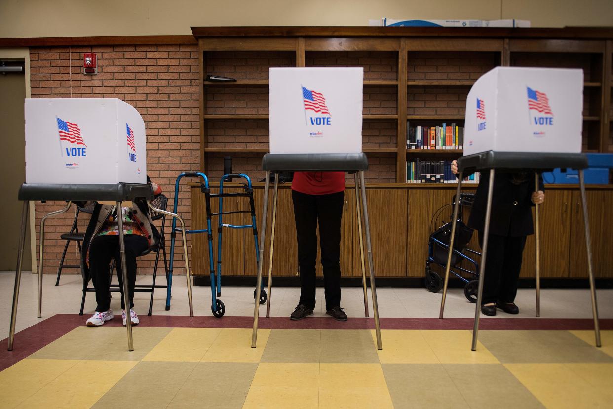 Iva Woke, left, a 100-year-old Maryland resident, joins others in early voting, Oct. 25, 2018. (Photo: Jim Watson/AFP/Getty Images)