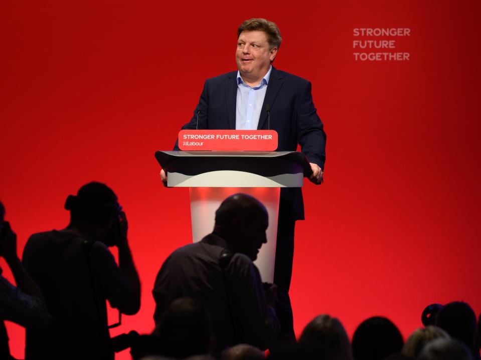 Evans reacts to chants and jeers as he speaks on day one of the Labour Party conference (Getty)