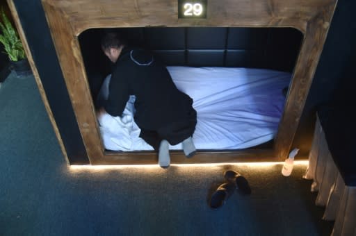 A worker prepares a sleep cabin for a new client at Nap York, in New York