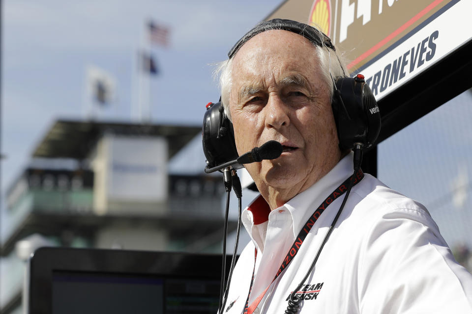 FILE - In this May 16, 2017, file photo, car owner Roger Penske watches practice for the Indianapolis 500 auto race at Indianapolis Motor Speedway, in Indianapolis. Penske, at 83 and considered high risk to the coronavirus as a 2017 kidney transplant recipient, still makes the daily three-minute commute to his Bloomfield Hills, Mich, office. He works 12 or more hours a day from his conference room at Penske Corp., which has a skeleton crew all practicing social distancing. Penske also had the small matter of planning his first Indianapolis 500. (AP Photo/Darron Cummings, File)