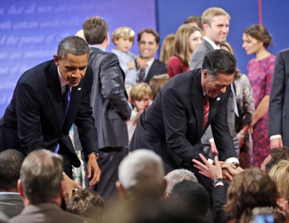 Republican presidential candidate, former Massachusetts Gov. Mitt Romney, right, and President Barack Obama, left, greet members of the audience at the end of the final debate at Lynn University, Monday, Oct. 22, 2012, in Boca Raton, Fla. (AP Photo/Pablo Martinez Monsivais)