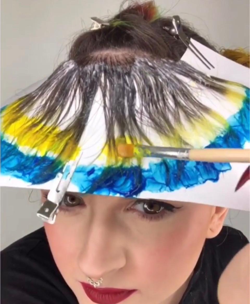 We chatted with St. Louis-based hair pro Caitlin Ford on how she mastered the creation of a rainbow bangs. See a video of her dyeing process here.