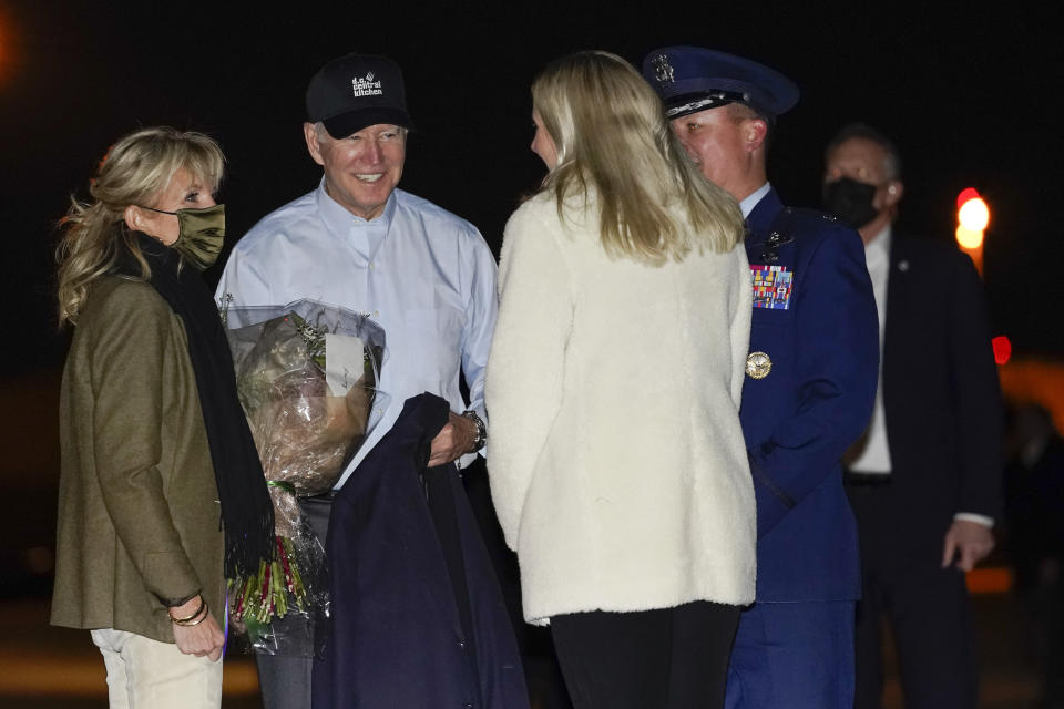 President Joe Biden and first lady Jill Biden are greeted before boarding Air Force one at Andrews Air Force Base, Md., Tuesday, Nov. 23, 2021, en route to Nantucket, Mass. (AP Photo/Carolyn Kaster)