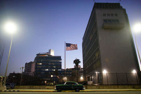 A vintage car passes by in front of the U.S. Embassy in Havana, Cuba, January 11, 2017. REUTERS/Alexandre Meneghini