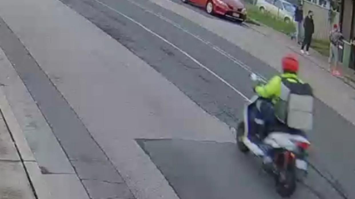 CCTV of the alleged offender travelling on his white motor scooter.