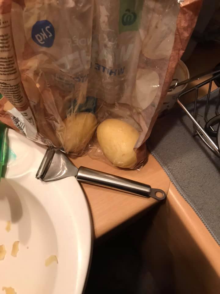 A photo of the Woolworths potatoes next to a peeler.