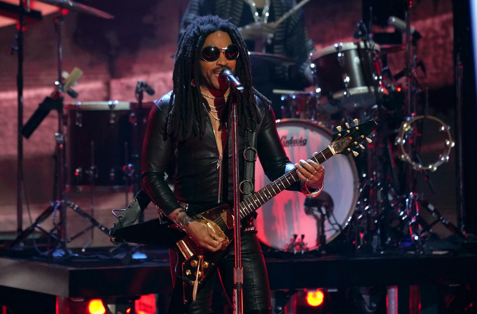 FILE - Lenny Kravitz performs at the iHeartRadio Music Awards on Monday, March 27, 2023, at the Dolby Theatre in Los Angeles. Music superstars Lenny Kravitz, Billie Eilish and H.E.R. will team with advocacy nonprofit Global Citizen for a concert in front of the Eiffel Tower designed to convince world leaders to take further action against climate change. (AP Photo/Chris Pizzello, File)