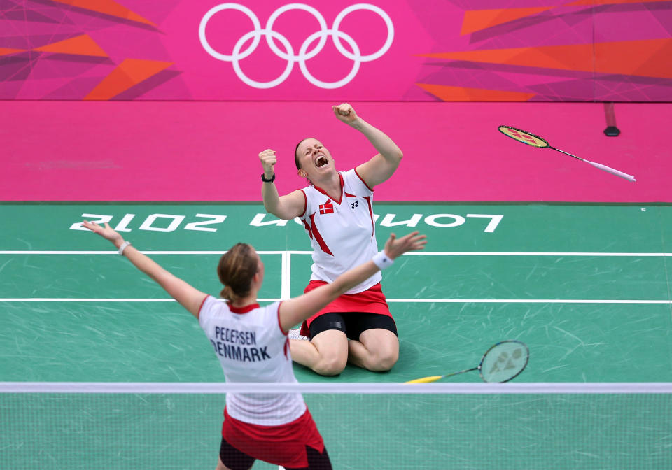 LONDON, ENGLAND - JULY 31: Christinna Pedersen and Kamilla Rytter Juhl of Denmark celebrate victory in their Women's Doubles Badminton match against Yunlei Zhao and Qing Tian of China on Day 4 of the London 2012 Olympic Games at Wembley Arena on July 31, 2012 in London, England.. (Photo by Julian Finney/Getty Images)
