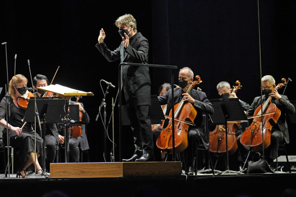 CORRECTS SPELLING OF FIRST NAME TO ESA INSTEAD OF ESSA - Guest conductor Esa-Pekka Salonen, music director of the San Francisco Symphony and principal conductor of London's Philharmonia Orchestra, leads the New York Philharmonic as the orchestra performs before a live audience of 150 people for the first time since March 10, 2020, at The Shed in Hudson Yards, Wednesday, April 14, 2021, in New York. (AP Photo/Kathy Willens)