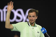 Daniil Medvedev of Russia celebrates after defeating Felix Auger-Aliassime of Canada in their quarterfinal match at the Australian Open tennis championships in Melbourne, Australia, early Thursday, Jan. 27, 2022. (AP Photo/Andy Brownbill)