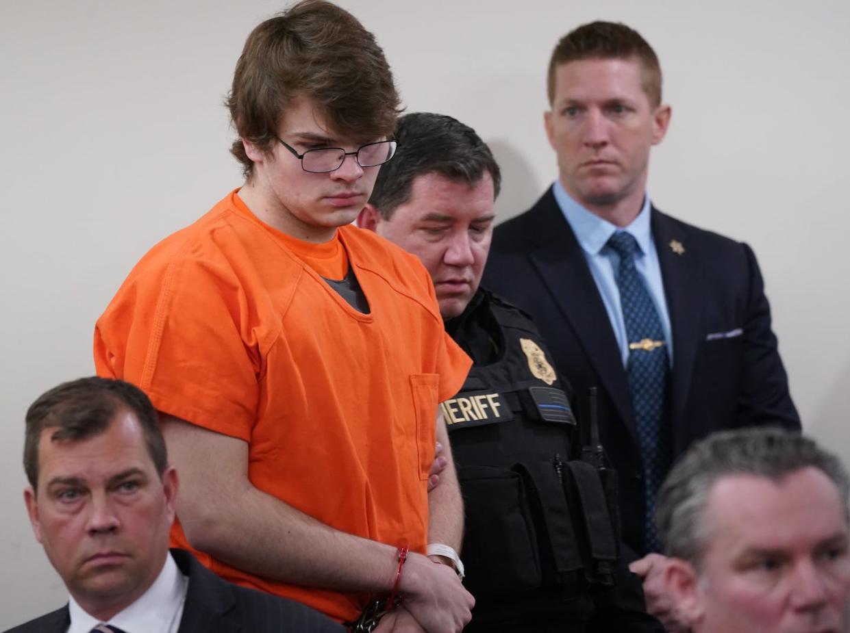 Dressed in orange prison garb, Payton Gendron is sentenced to life in prison for the murder of 10 Black people in Buffalo, N.Y. <a href="https://www.gettyimages.com/detail/news-photo/payton-gendron-is-escorted-back-into-the-courtroom-by-news-photo/1247183130?adppopup=true" rel="nofollow noopener" target="_blank" data-ylk="slk:Derek Gee/Buffalo News/Pool via Xinhua;elm:context_link;itc:0;sec:content-canvas" class="link ">Derek Gee/Buffalo News/Pool via Xinhua</a>