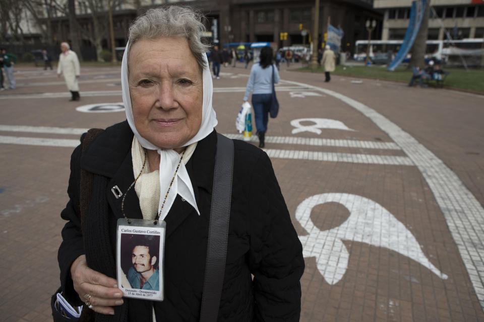 Nora Morales Cortiñas member of Madres de Plaza de Mayo holds a portrait of her son Carlos Gustavo Cortiñas during an exclusive portrait session at the Plaza de Mayo on September 03, 2009 in Buenos Aires, Argentina.