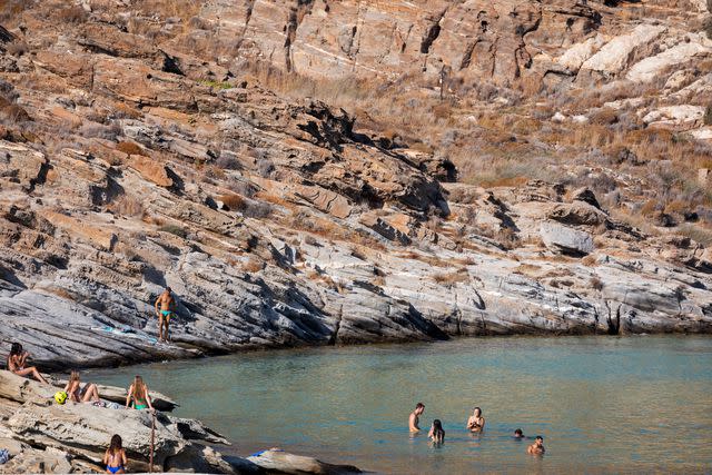 <p>Margarita Nikitaki</p> Sunbathing at Monastiri Beach.