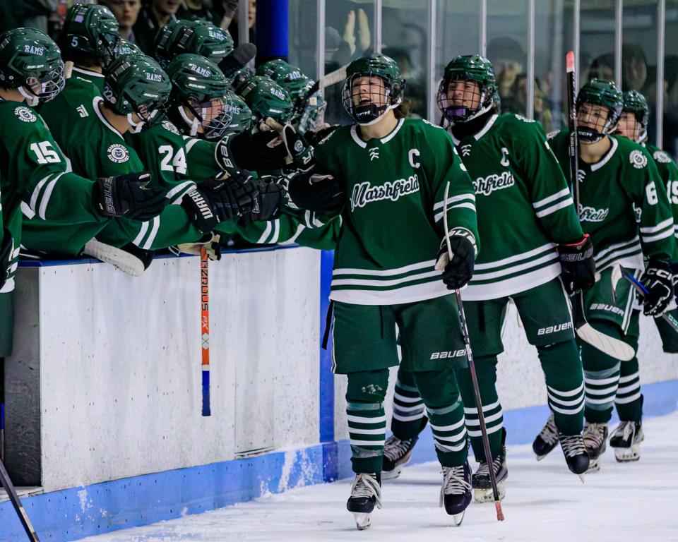 Marshfield celebrates its first goal against Plymouth North.