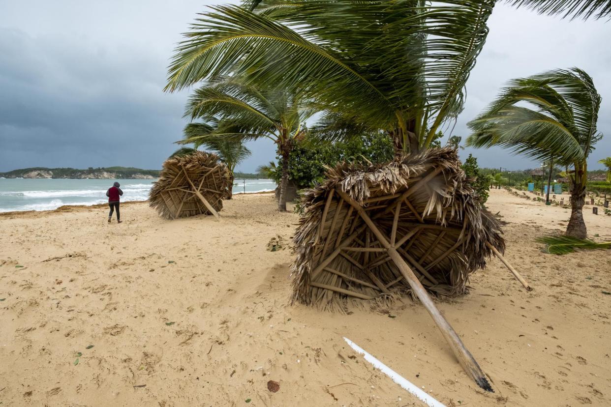 Broken umbrellas lay on the beach, felled by Hurricane Fiona in Punta Cana, Dominican Republic, Monday, Sept. 19, 2022.