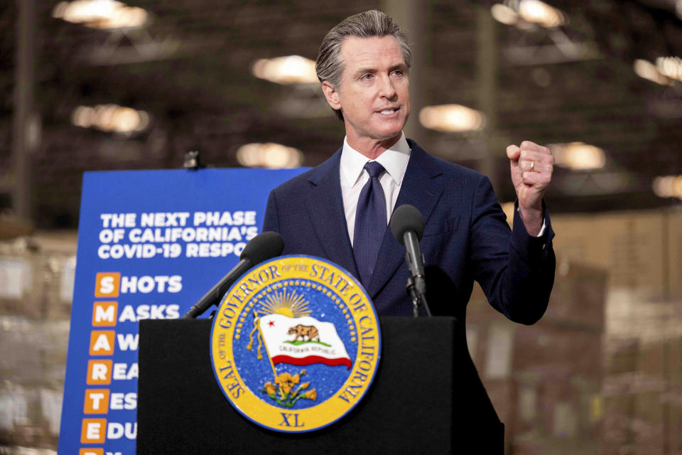 Gov. Gavin Newsom announces the next phase of California's COVID-19 response called "SMARTER," during a press conference at the UPS Healthcare warehouse in Fontana, Calif., Thursday, Feb. 17, 2022. The plan is to move from the pandemic stage into an endemic stage in which people will learn to live COVID. (Watchara Phomicinda/The Orange County Register/SCNG via AP)