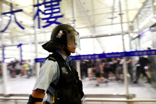 A police officer is pictured after a scuffle with pro-democracy protestors at Hong Kong's International Airport on August 13