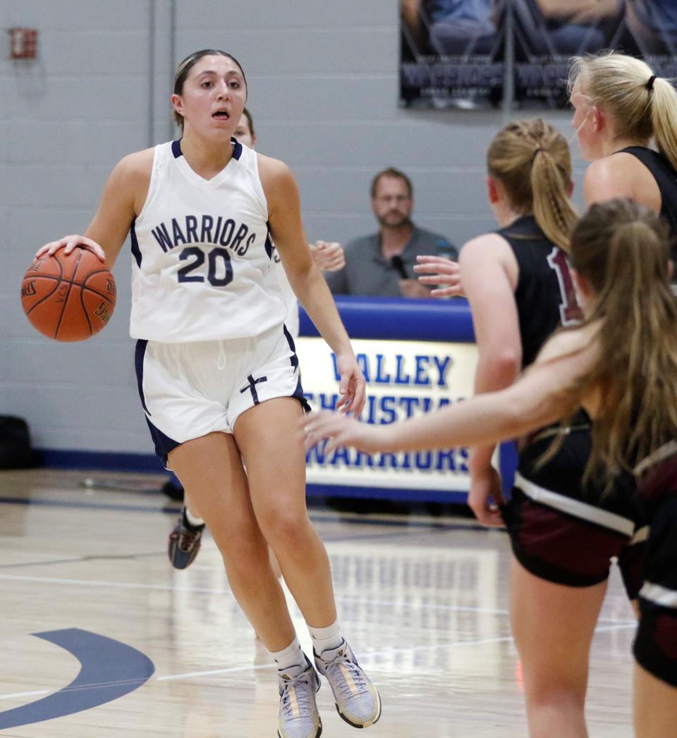 Valley Christian senior Anna Y. Giannopoulos ended her Warriors career by scoring 30 points and grabbing 15 rebounds for a double-double in a WIAA regional playoff, eclipsing the 1000 career points milestone in her final high school game.