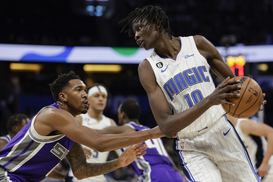 Orlando Magic center Bol Bol (10) drive against Sacramento Kings guard Malik Monk (0) during overtime of an NBA basketball game, Saturday, Nov. 5, 2022, in Orlando, Fla. (AP Photo/Kevin Kolczynski)