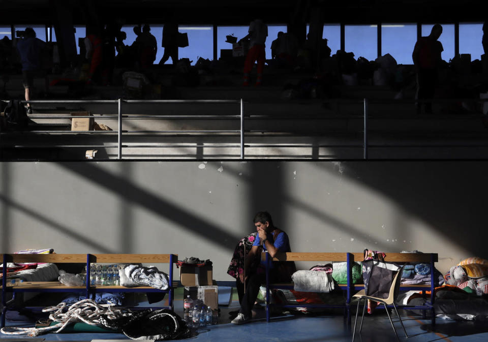 <p>A man sits on a bench after spending the night in a makeshift camp set up inside a gymnasium following an earthquake, in Amatrice, central Italy, Aug. 25, 2016. (Photo: Alessandra Tarantino/AP)</p>