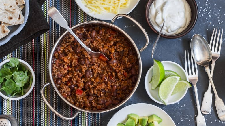 Pot of chili and toppings