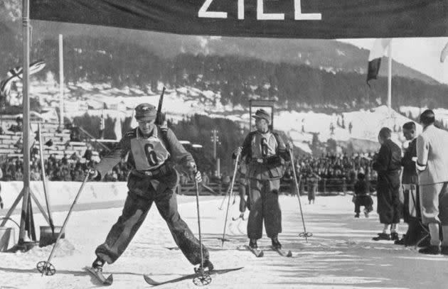 The German military ski patrol team crossing the finish line to take fifth place during the 1936 Winter Olympics in Garmisch-Partenkirchen, Germany. (Photo: Past Pix via Getty Images)