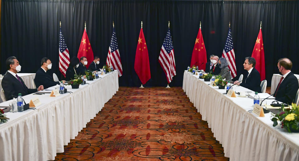 Secretary of State Antony Blinken, second from right, joined by national security adviser Jake Sullivan, right, speaks while facing Chinese Communist Party foreign affairs chief Yang Jiechi, second from left, and China's State Councilor Wang Yi, left, at the opening session of US-China talks at the Captain Cook Hotel in Anchorage, Alaska, Thursday, March 18, 2021. (Frederic J. Brown/Pool via AP)