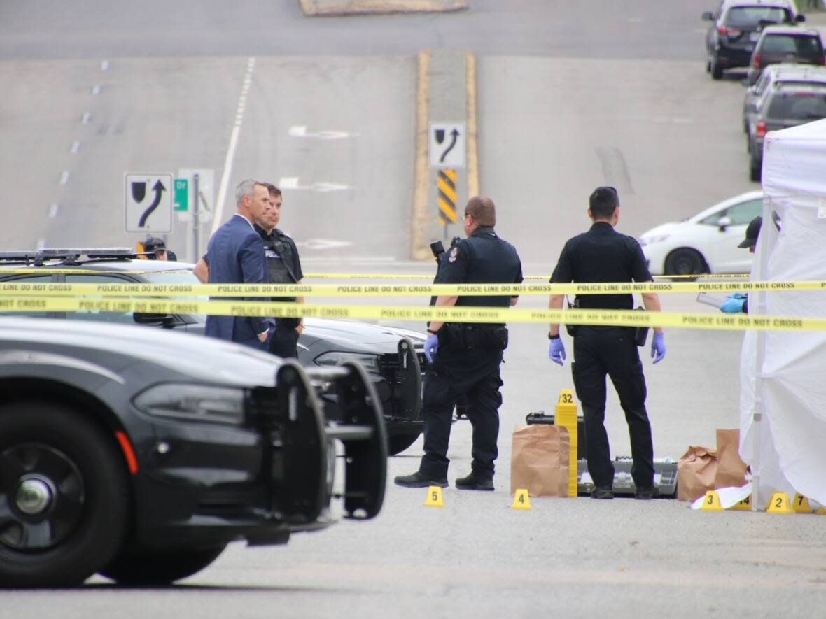 Police are investigating after two people were killed overnight in Vancouver on May 27, and May 28, 2023. A fatal stabbing in the city's West End and a targeted shooting in south Vancouver, the scene pictured here, occurred within four hours of each other. (Shane MacKichan/CBC News - image credit)