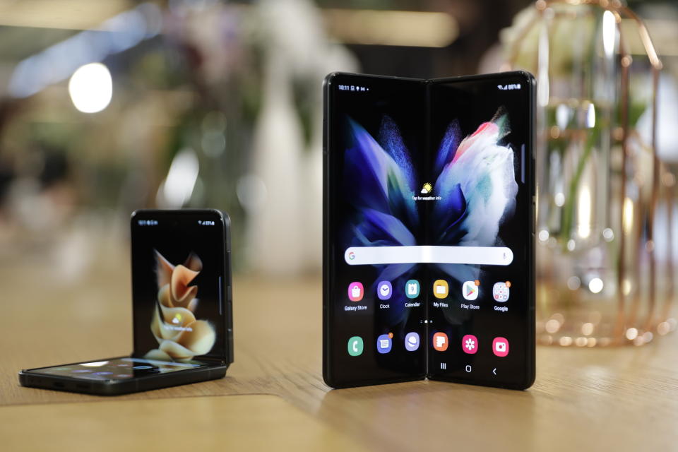 From left, Samsung Galaxy Flip 3 and Fold 3 are displayed on Monday, Aug. 9, 2021 at Samsung KX in London. Samsung is hoping cheaper but more durable versions of its foldable phones will broaden the appeal of a high-concept design that’s so far fizzled with consumers.(AP Photo/Tristan Werkmeister)