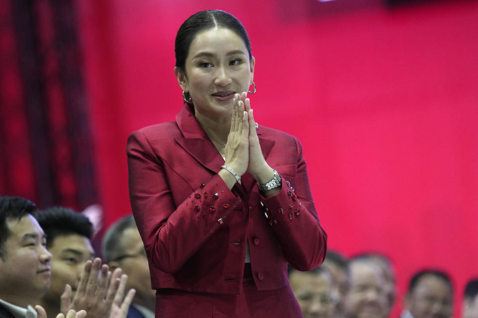 New leader of Pheu Thai Party, Paetongtarn Shinawatra, daughter of Thailand's former Prime Minister Thaksin Shinawatra, offers a traditional greeting known as a "wai" after her address at the party headquarters in Bangkok, Thailand, Friday, Oct. 27, 2023. Thailand’s ruling party has selected as its leader the daughter of the country’s divisive former prime minister, highlighting her family’s continuing influence more than two decades after her father entered politics.(AP Photo/Sakchai Lalit)