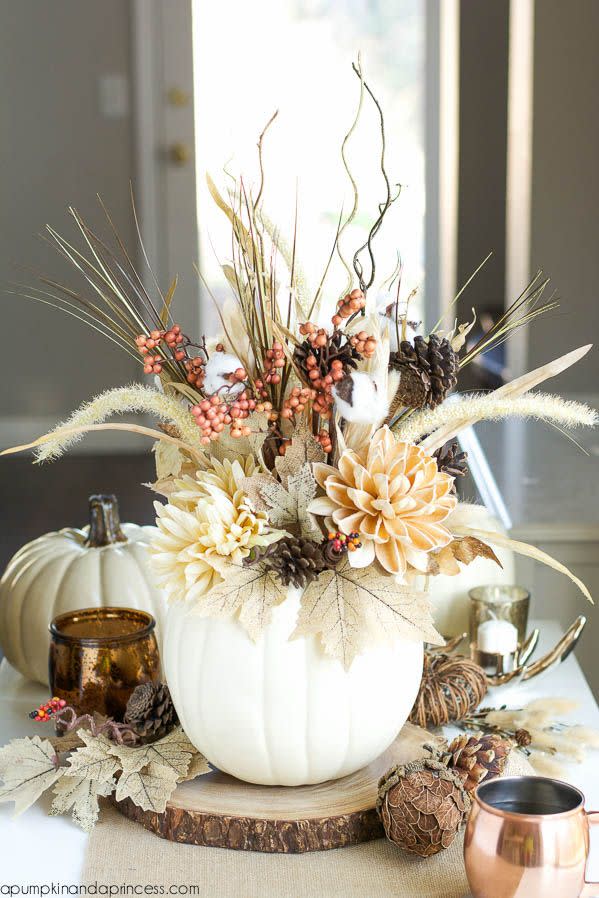 <p>The arrangement of pinecones, branches, and burlap leaves inside this white pumpkin borders both rustic and elegant.</p><p><em><a href="http://apumpkinandaprincess.com/2015/09/diy-pumpkin-vase.html" rel="nofollow noopener" target="_blank" data-ylk="slk:Get the tutorial at A Pumpkin and a Princess »;elm:context_link;itc:0;sec:content-canvas" class="link ">Get the tutorial at A Pumpkin and a Princess »</a></em></p>