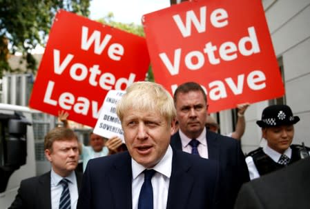 FILE PHOTO: Boris Johnson leaves his office in London