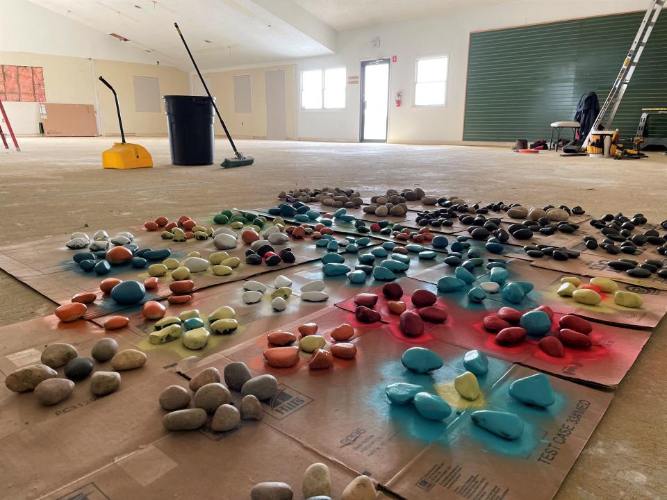 Stones covered in spray paint dry inside a clubhouse under renovation at Tap-In's, Thursday, May 5, 2022. The stone will decorate a miniature golf course on the property near Howell.